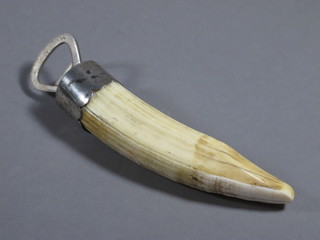 A silver plated and tusk bottle opener 7"  ILLUSTRATED
