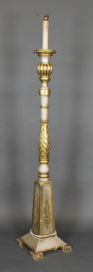 A gilt painted turned and reeded standard lamp