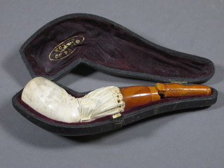 An amber and Meerschaum cheroot holder in the form of a  stockinged leg, f, cased