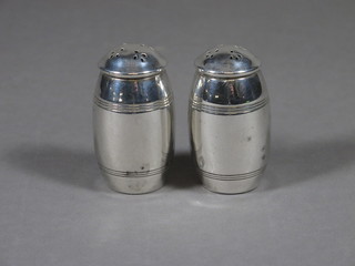 2 Sterling silver barrel shaped pepperettes, 2 ozs