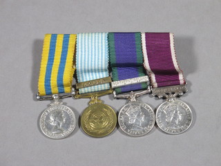 A group of 4 miniature medals comprising Korea medal, United  Nations Korea medal, Campaign Service medal and Arm Long  Service Good Conduct medal