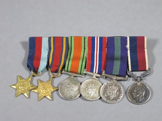 A group of 6 miniature medals comprising 1939-45 Star, Burma Star, Defence War medal, General Service Medal, RAF Long  Service Good Conduct medal - George VI issue