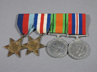 A group of 4 medals attributable to D F Locke comprising 1939-45 Star, Africa Star, Defence and War medal together with  an RAF Certificate of Service to M L Norton and an Airman's  service book