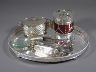 An oval silver plated galleried tray 12", a circular silver plated preserve jar in the form of a drum etc