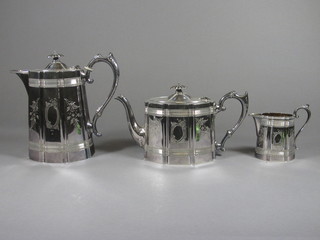 An Edwardian Britannia metal 3 piece tea service of oval form comprising teapot, hotwater jug and milk jug