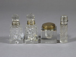 A cylindrical cut glass perfume phial with a silver lid 3", 2  square glass perfume bottles and a square glass inkwell 1"