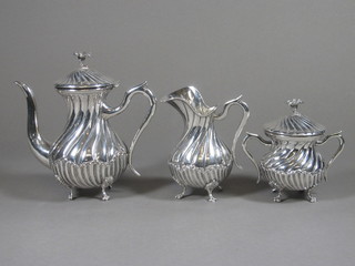 A 3 piece silver plated bachelor's coffee service with demi-reeded decoration comprising coffee pot, cream jug and  lidded sugar bowl