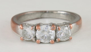 A lady's dress ring set 3 white stones