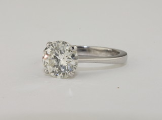 A lady's 18ct white gold solitaire dress ring set a brilliant cut diamond, approx 1.87ct,