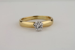 A lady's 18ct gold dress ring set a diamond