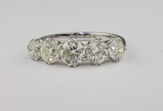 A lady's 18ct white gold dress ring set 5 diamonds, approx  3.27ct