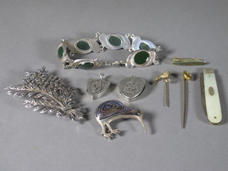 A silver bladed folding fruit knife with mother of pearl mount, 2 silver lockets, a silver and enamelled Kiwi brooch etc