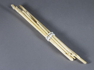 A collection of ivory crochet hooks