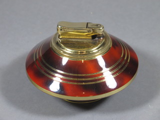 A Calibri circular gilt and brown enamelled table lighter