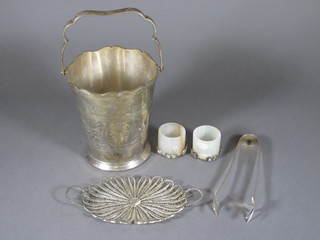 A silver plated ice pail, a pair of onyx and filigree mounted salts and a filigree twin handled tray