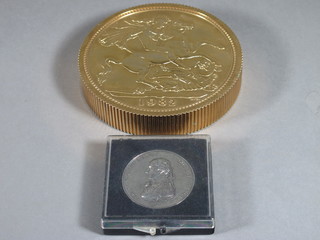 A facsimile Balkans Trafalgar medal together with a circular paperweight in the form of a 1982 sovereign 4 1/2"