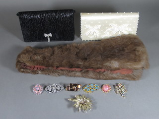 A small collection of costume jewellery, a fur stole and 2 clutch  bags