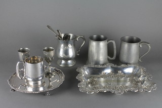 A silver plated salver with bracketed border raised on 4 scrolled feet 8", a rectangular embossed silver plated dish 11", a silver  plated tankard, 2 do. goblets, 3 pewter goblets and a collection of  flatware