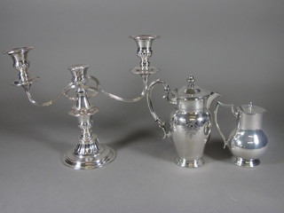 A silver plated 3 light candelabrum and 2 silver plated hotwater  jugs