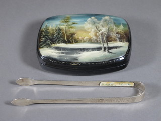 A pair of Georgian silver bright cut sugar tongs, London 1806 together with a Russian jar and cover the lid decorated a snowy  landscape 4 1/2"
