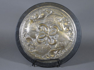 A circular Eastern embossed white metal plaque decorated birds 12"