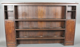 A Georgian oak dresser back with moulded cornice fitted 3 shelves flanked by a pair of cupboards, 84"w x 51 1/2"h x 8"d