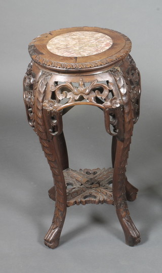 A circular pierced carved Chinese hardwood jardiniere stand with  a pink veined marble top 12" 23"