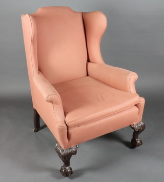 A Georgian style mahogany winged armchair raised on cabriole supports  ILLUSTRATED