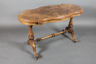 A Victorian figured walnut stretcher table raised on turned supports with H framed stretcher 47"w x 28"h x 23 1/2"d