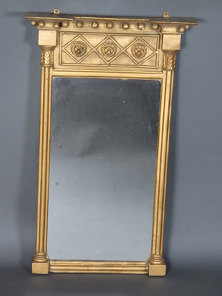 A Regency rectangular plate chimney mirror contained in a decorative gilt frame 17" x 27"