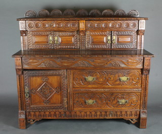 A Victorian carved oak sideboard, the raised back fitted 2 short drawers above a double cupboard, the base fitted 1 long drawer  above 2 short drawers flanked by a cupboard, made up, 55 1/2"