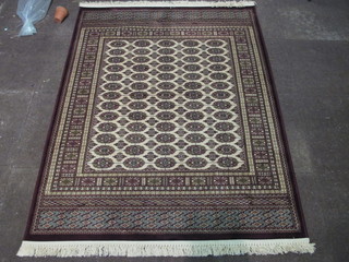 A Bokhara Belgian cotton rug with octagons to the centre 68" x  49"