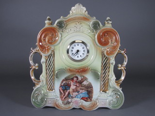 An Edwardian mantel clock contained in a pottery case decorated romantic scenes 13"