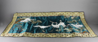 An Oriental silk embroidered panel decorated a stork 18" x 38"