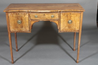 A 19th Century mahogany sideboard of serpentine outline with crossbanded top inlaid satinwood stringing, fitted 1 long drawer  flanked by a pair of cupboards, raised on square tapering  supports ending in spade feet 41 1/2"w x 33"h x 17"d