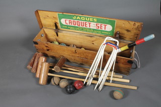A Jacques croquet set comprising 14 balls, 4 mallets, post and 6 hoops