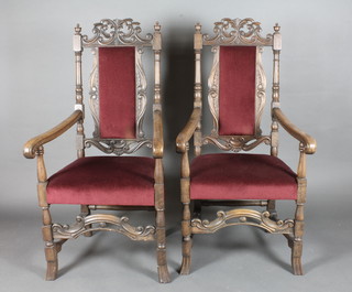 A pair of 19th Century carved walnut high back carver chairs,  the seats and backs upholstered in red Dralon