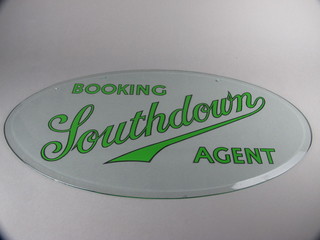 An oval glass advertising sign for Southdown Booking Agents,  16", slight chips to rim