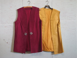 A lady's 1960's purple suede jerkin and a yellow leather jerkin
