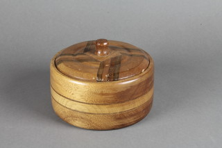 A turned oak parquetry jar and cover 7"