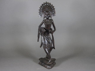 An Eastern carved wooden figure of a standing lady 20"
