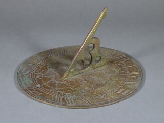 A circular gilt metal sundial 8"