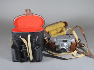 An Agfa camera, a pair of Russian 8 x 30 binoculars and a leather monocular case