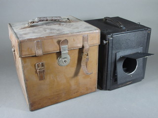 An early camera by Videx, no lenses, complete with leather carrying case