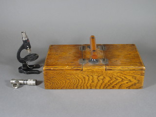 An oak rectangular twin section card/cigarette box with hinged  lid together with a microscope 11"