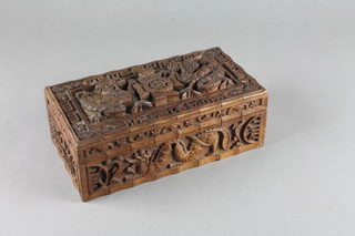 An Oriental carved box with hinged lid carved the crest of the  6th Battalion of the East Surrey 1902 8"