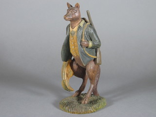 A Continental carved wooden figure of The Fox Gamekeeper 7"