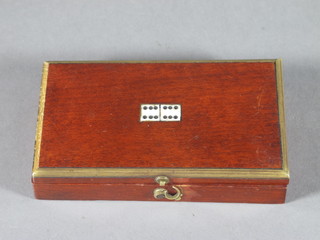 A set of miniature dominoes contained in a wooden box with  hinged lid 4"