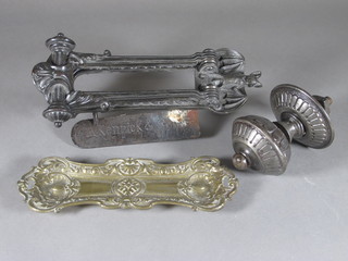 A Victorian letter box/door knocker decorated a bat, the reverse  marked A Kenrick & Sons, an iron door knob and gilt metal pen  tray