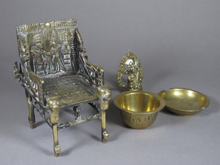 An Egyptian style bronze miniature throne 7", 2 circular bowls  2" and a figure of a Deity 4"